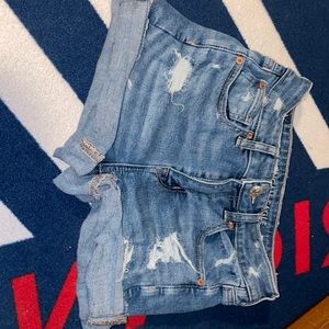 Distressed blue Jean shorts. High waisted, super stretch.
